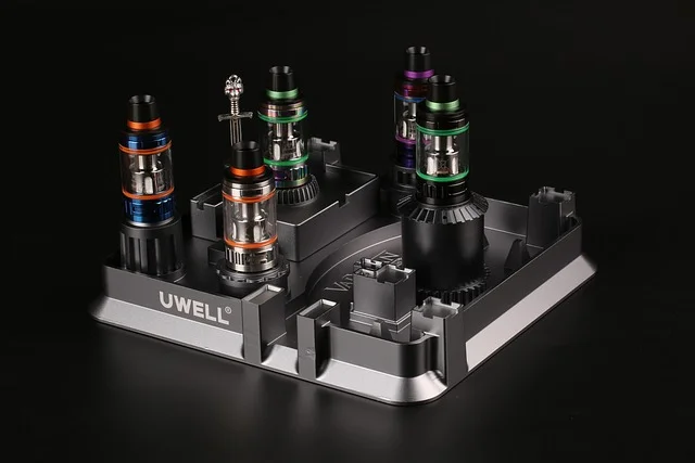 cola geekbar in a rideshare cup holder next to iced coffee